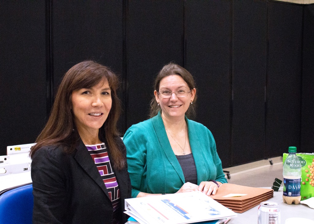 AIHEC President & CEO Carrie Billy, left, and Research & Policy Associate Katherine Cardell, observe GISS activities.